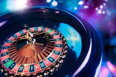 harmonibet Caribbean Stud Poker mobile interface showing player hand, fold/raise buttons, and balance display